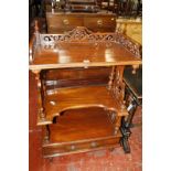 A Victorian mahogany three tier whatnot with scroll and column supports 119cm high, 72cm wide