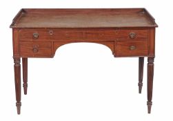 A George IV mahogany dressing table or desk, circa 1825, in the manner of Gillows of Lancaster,