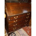 A George III mahogany bureau with four long graduated drawers 98cm wide Best Bid