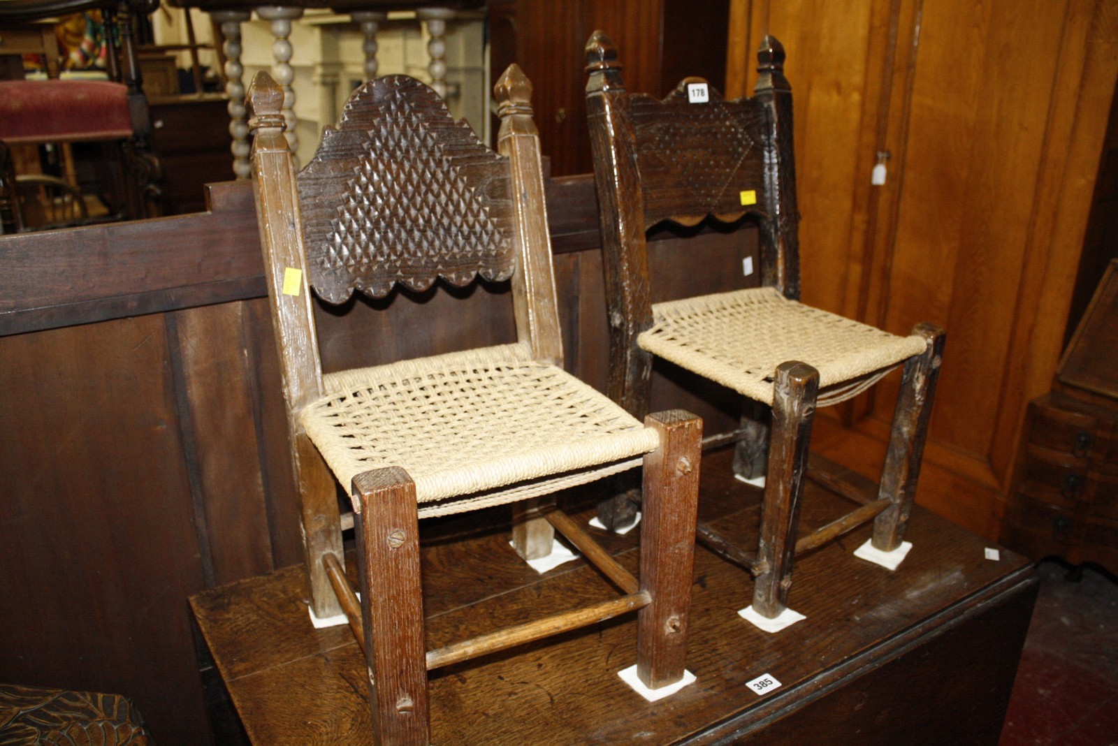 A pair of Indian child's chairs with rush seats Best Bid