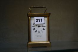A French gilt brass carriage clock, the enamel face dial marked W. Bruford & Sons, 14.5cm high (