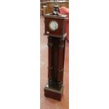 A William IV style mahogany clock long case floor standing clock with twin fluted columns supporting