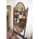 An Edwardian oval cheval mirror. 168cm high.