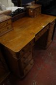 A Victorian satinwood pedestal desk with two additional stationery drawers and a cabinet to match.