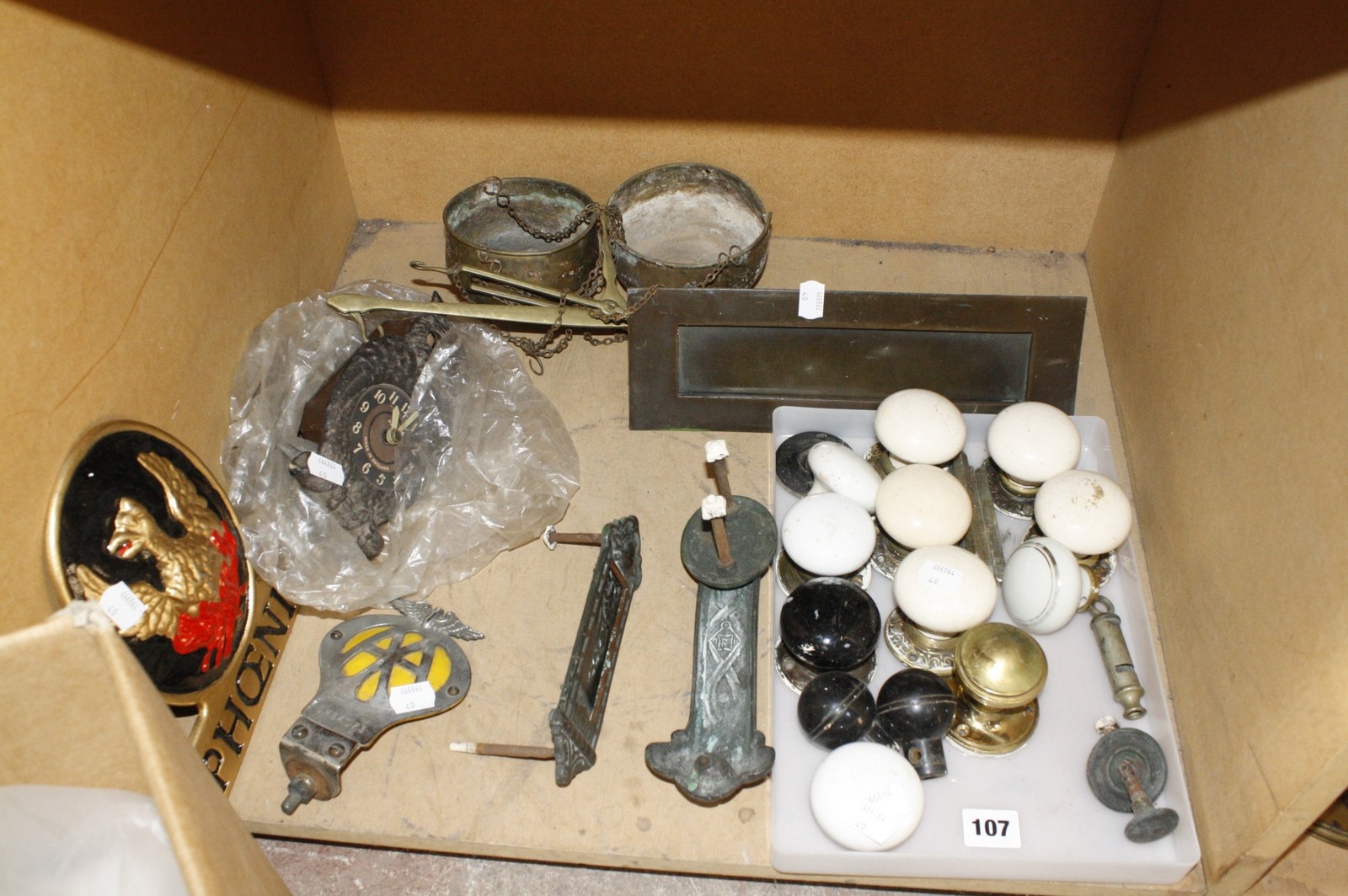 A quantity of vintage ceramic door knobs, with other decorative items of door furniture, together