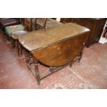 An 18th century style oak gateleg table