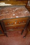 A French marble topped bedside cabinet on fluted legs