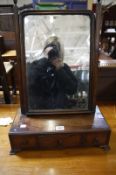 A George III mahogany dressing mirror with three short drawers Best Bid
