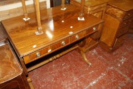 A Regency style mahogany sofa table on lyre end supports.