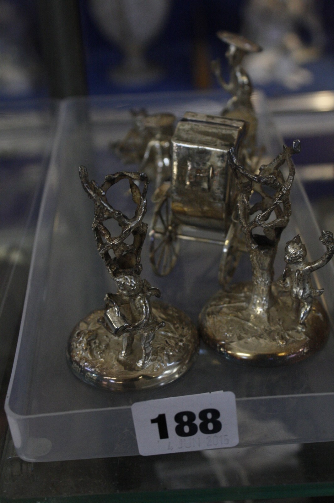 A quantity of silver to include three various silver Chinese figures, a miniature chest of