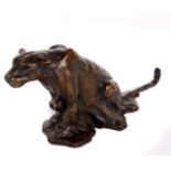 A bronze model of a seated leopard, signed indistinctly, 9cm high approx