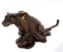 A bronze model of a seated leopard, signed indistinctly, 9cm high approx