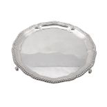 A silver shaped circular salver by Elkington & Co  A silver shaped circular salver by