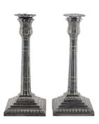 A pair of electro-plated candlesticks, with shaped circular sconces  A pair of electro-plated