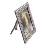 A Victorian silver mounted photo frame by Samuel Jacob, London 1896  A Victorian silver mounted