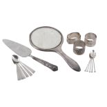 A collection of silver items, to include: a silver mounted hand mirror  A collection of silver