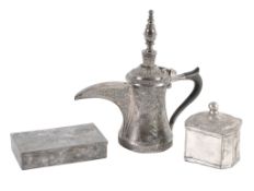An Islamic silver coloured coffee pot, unmarked  An Islamic silver coloured coffee pot,