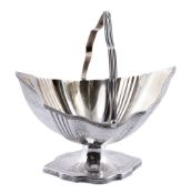 A George III silver shaped navette pedestal sugar basket by Peter & Ann Bateman  A George III silver