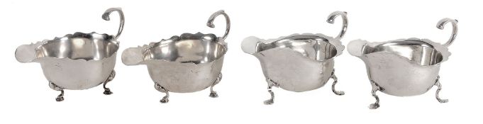 A pair of Edwardian silver shaped oval sauce boats by Williams Ltd  A pair of Edwardian silver