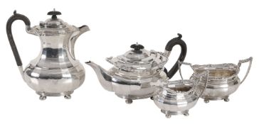 A matched silver oblong baluster four piece tea service, Chester 1907 and 1911  A matched silver