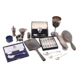 A collection of silver items, to include: a Victorian silver pedestal cup by...  A collection of