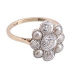 An Edwardian diamond and pearl cluster ring, circa 1910, the central old brilliant cut diamond in a