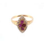 A ruby and diamond cluster ring, the marquise shaped panel set with a central cluster of calibre