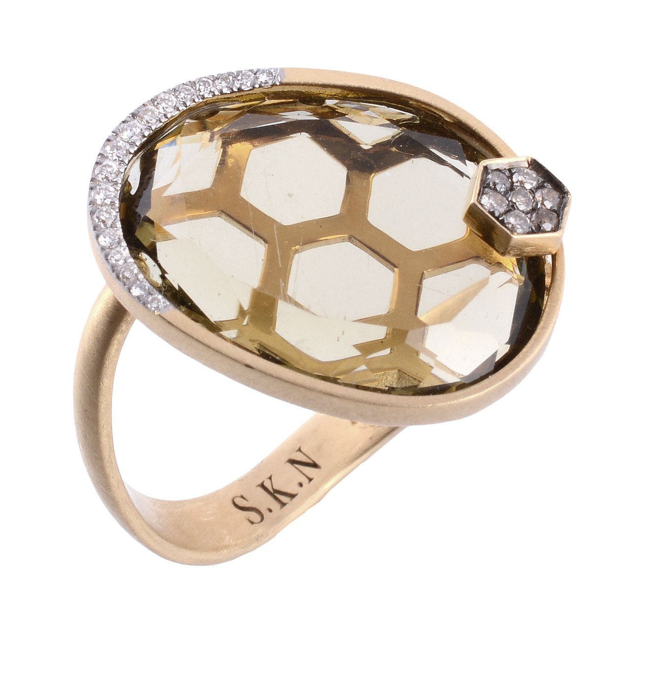 A citrine and diamond ring, the flattened oval shaped citrine with diamond accents to the base of