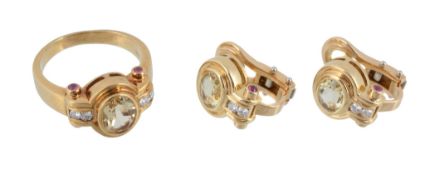 A citrine, diamond and ruby ring and matching earrings, the ring set with a central oval shaped