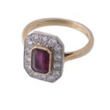 An 18 carat gold ruby and diamond ring, the central rectangular cut cornered ruby in a cut down