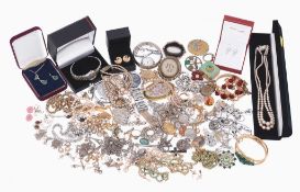 A collection of costume jewellery, including a late Victorian silver coloured brooch with a central