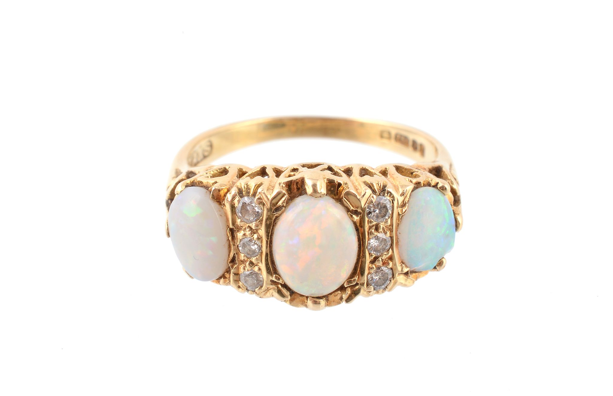 An 18 carat gold opal and diamond ring, the three oval shaped opals claw set with brilliant cut