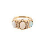 An 18 carat gold opal and diamond ring, the three oval shaped opals claw set with brilliant cut