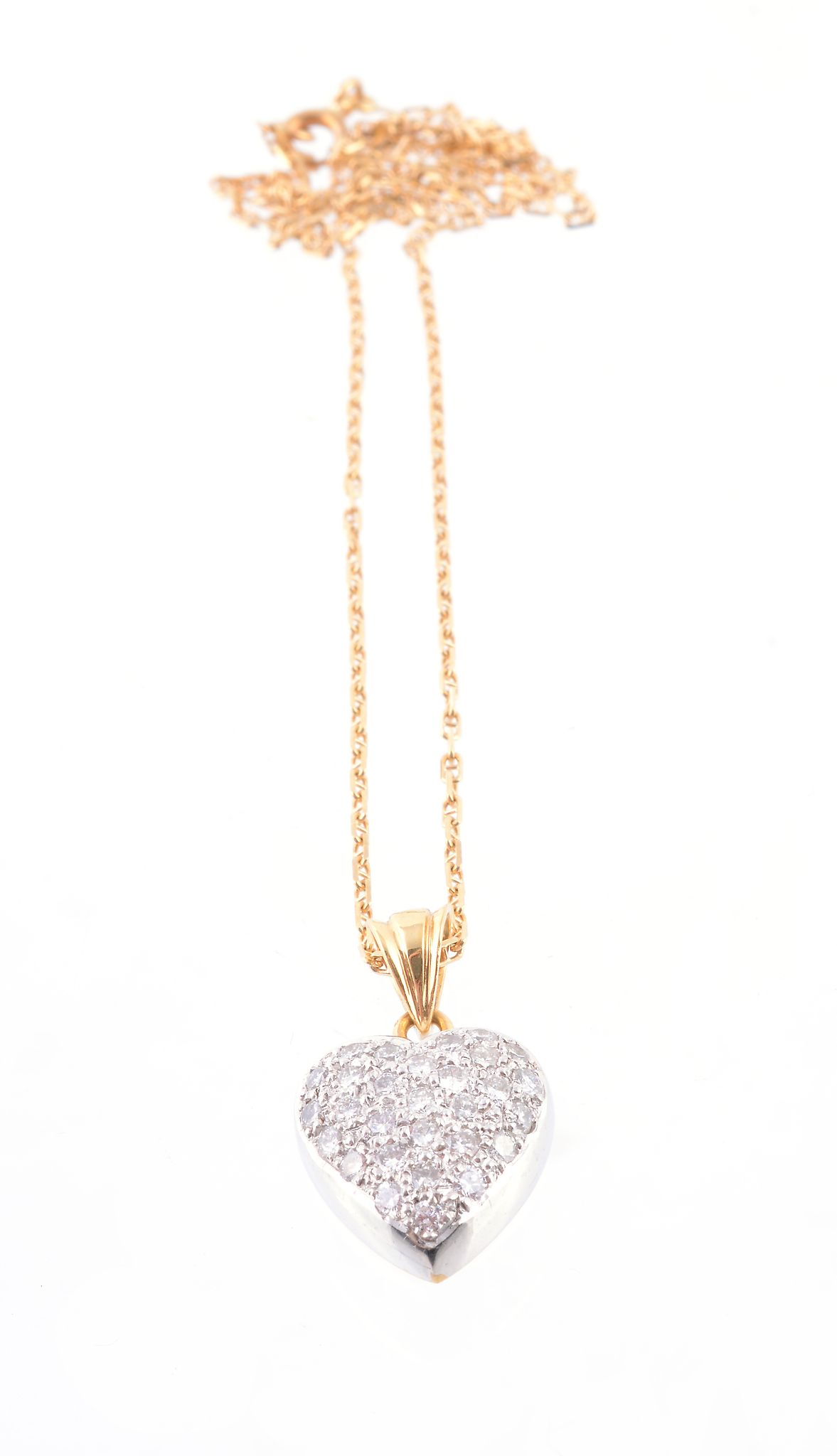 A diamond heart pendant, the heart shaped pendant pavé set with brilliant cut diamonds, suspended