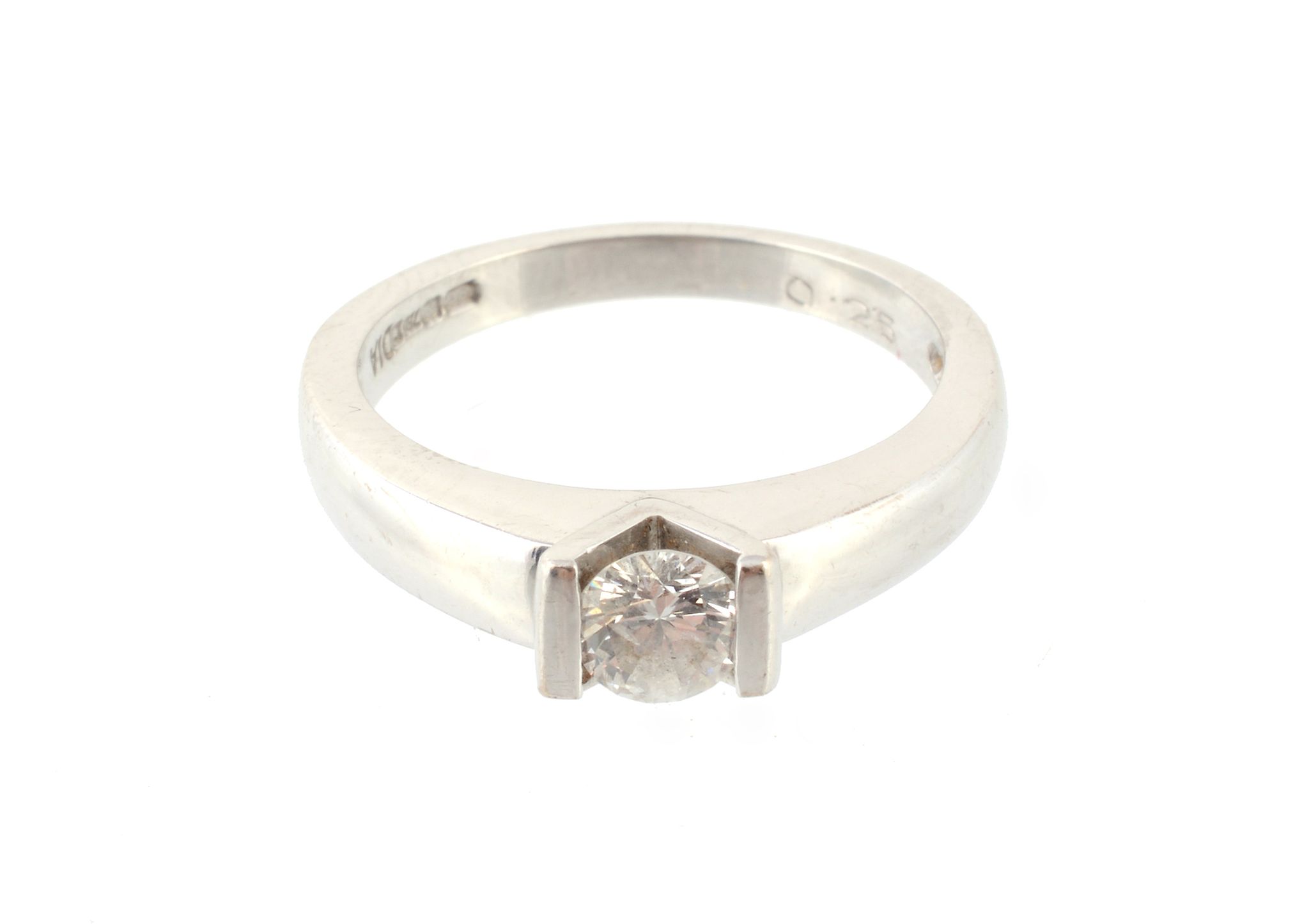 A single stone diamond ring, the brilliant cut diamond in a suspension setting, on a polished