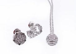 A pair of diamond earrings and a necklace, the cluster ear studs convert to diamond drop ear