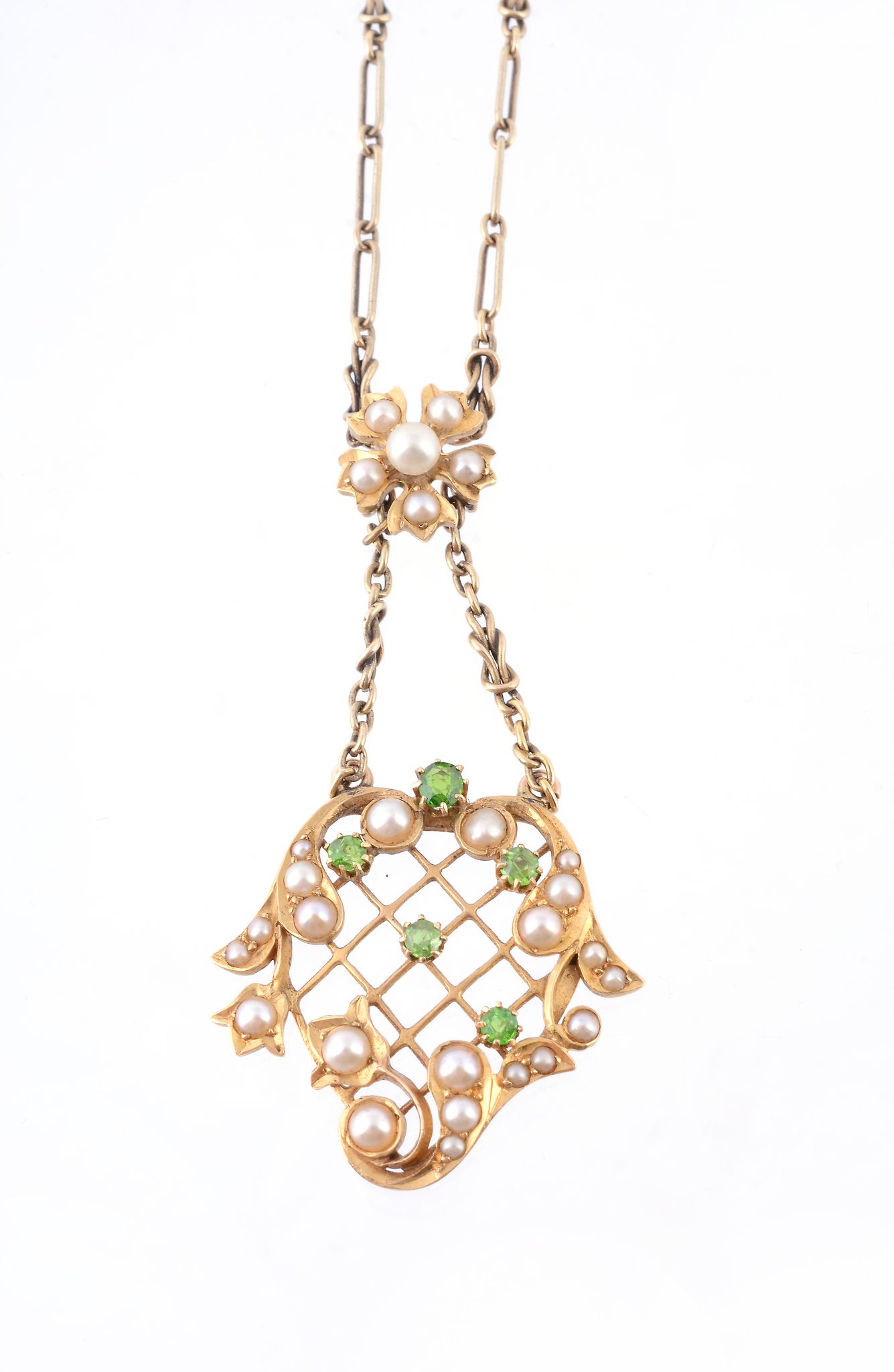 A half pearl and demantoid garnet pendant, the pendant of scroll and pierced lattice design, set