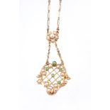 A half pearl and demantoid garnet pendant, the pendant of scroll and pierced lattice design, set