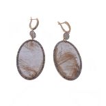 A pair of rutile quartz and diamond earrings, the oval shaped rutile quartz within a surround of