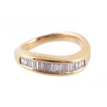 Diamond half eternity ring, the fifteen baguette cut diamonds in a channel setting to a shaped