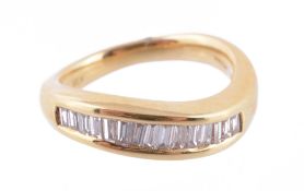 Diamond half eternity ring, the fifteen baguette cut diamonds in a channel setting to a shaped