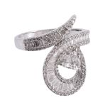 A diamond dress ring, of twisting design set throughout with brilliant cut, baguette cut, pear cut