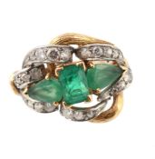 An emerald and diamond dress ring, the central rectangular shaped emerald in a four claw setting,