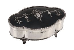 A silver and tortoiseshell dressing table box by The Goldsmiths & Silversmiths Co. Ltd, London