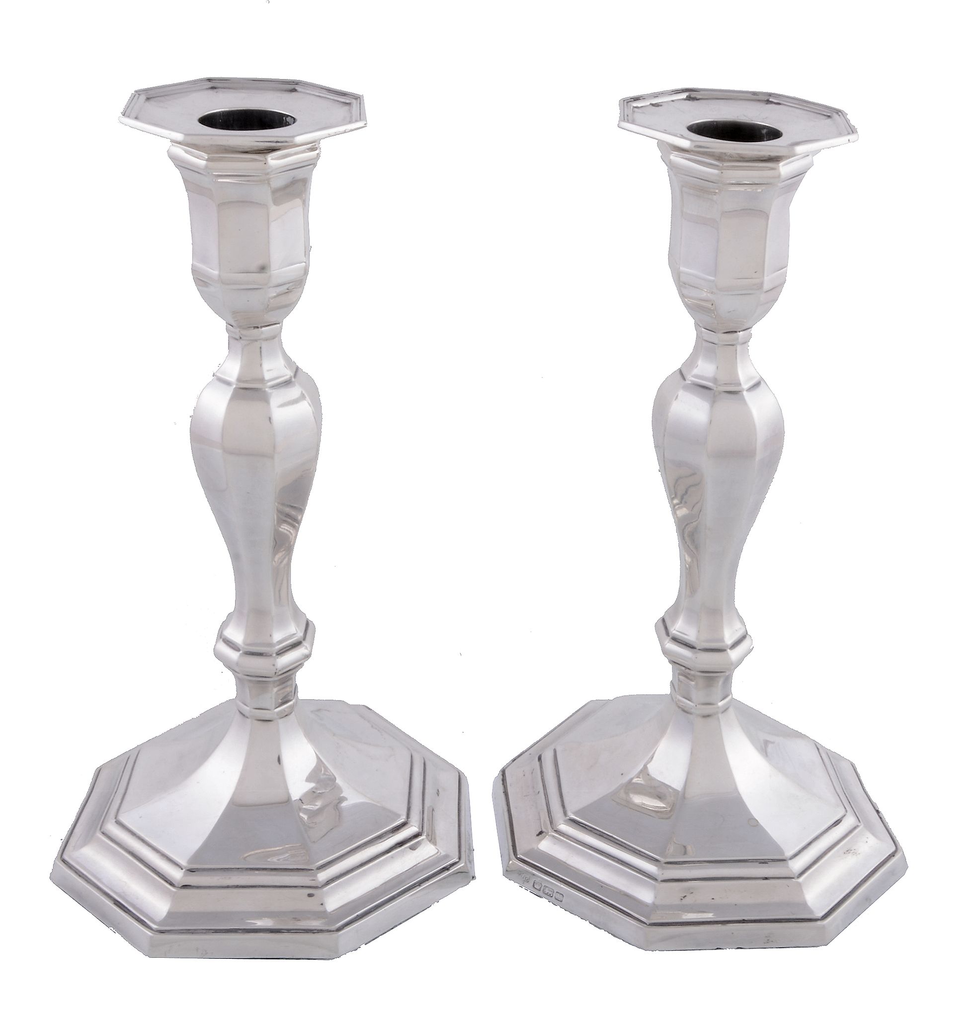 A pair of silver octagonal candlesticks by Hawksworth, Eyre & Co. Ltd, Sheffield 1916, plain, the