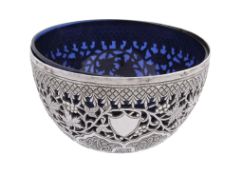 An Indian silver hemispherical bowl, unmarked, Kashmir circa 1900, chased and pierced with fruiting