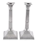 A pair of silver Corinthian column candlesticks by Goldsmiths & Silversmiths Co. Ltd., London 1927,