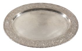 An American silver coloured oval meat platter by S. Kirk & Son Co., circa 1920, with a stiff leaf