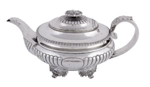 A George IV silver oval tea pot by Solomon Royes, London 1820, with an oval foliate finial to the