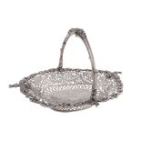 An Edwardian silver shaped oval basket by Mappin & Webb, London 1909, the swing handle cast and